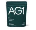 AG1 daily foundational nutrition package on a white background